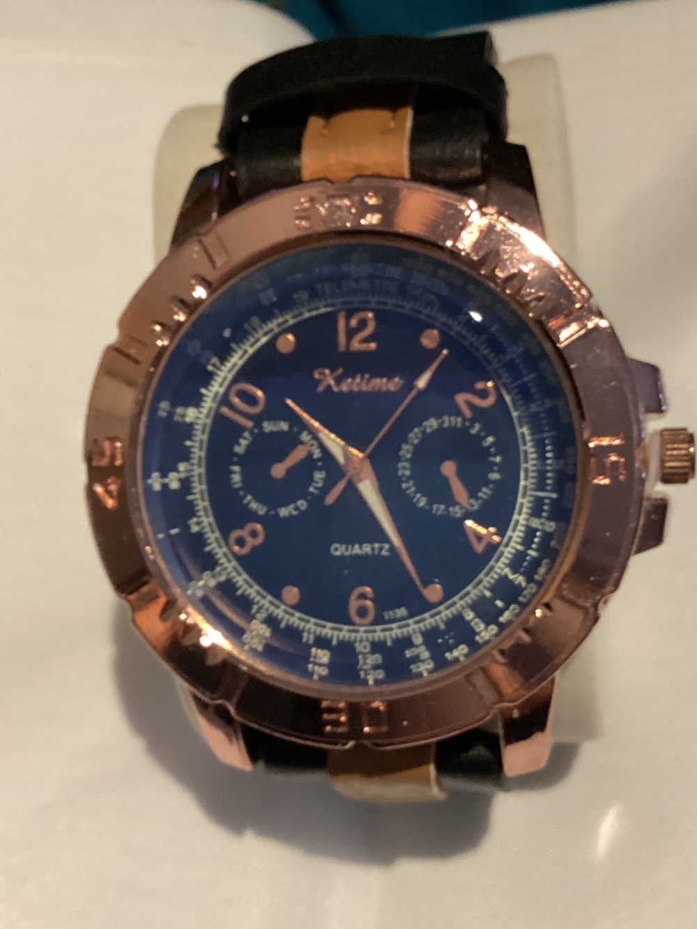 Men's Blue Dial Watch with Rose Gold Case and Black Strap